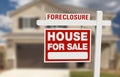 Foreclosure House For Sale Sign and House Royalty Free Stock Photo