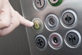 Forefinger pressing the alarm button in the elevator Royalty Free Stock Photo