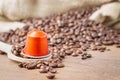 Coffee capsule on wooden spoon Royalty Free Stock Photo