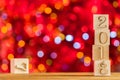 2018 in the foreground, displaces 2017. Christmas card. On bright bokeh background. Copy space for your text. Royalty Free Stock Photo