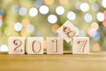 2018 in the foreground, displaces 2017. Christmas card. On bright bokeh background. Royalty Free Stock Photo