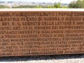 Lettering wall of the Italian Constitution with behind the panorama of Rome in Italy.