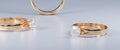 The foreground of the macro focus golden ring with 2 rings as a blurred on white background Royalty Free Stock Photo