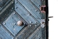 Foreground of old wooden door with iron handle. Royalty Free Stock Photo