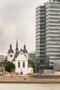 Contrasting Architecture: Alt St. Heribert Greek Orthodox Church and Modern Tower Blocks in Cologne Royalty Free Stock Photo