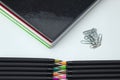 set of school tools with colored self-tips pens, clips and notebooks on white background Royalty Free Stock Photo