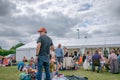 Crowds of people seen at an outdoor rock music festival