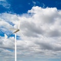 foreground of the top of a windmill for renewable electric energy production Royalty Free Stock Photo