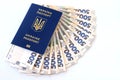 Foreign biometric passport with inscription in Ukrainian - Passport Ukraine, with new banknotes 500 hryvnia. Concept of money,