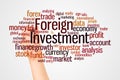 Foreign Investment word cloud and hand with marker concept