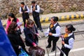 Foreign passengers boarding tourist Perurail train to Machu Picchu at the train station in Ollantaytambo, Peru Royalty Free Stock Photo