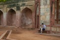 A tourist at UNESCO World Heritage Site Humayun's Tomb in Delhi Royalty Free Stock Photo