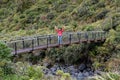 Foreign tourist visiting Wilkies Pools trail, Mount Egmont, New Zealand