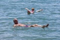 Foreign tourists float on the Dead Sea in Jordan.