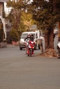 a foreign woman rides a motorcycle on the highway in the afternoon