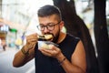 Foreigner eating street food in China Royalty Free Stock Photo