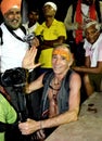 A foreigner sadhu from france sitting among locals, cheerful blessings during simhasth maha kumbh mela 2016, MP, India Royalty Free Stock Photo