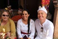 Foreing people in traditional Balinese clothes on Potong Gigi ceremony - Cutting Teeth, Bali Island, Indonesia Royalty Free Stock Photo