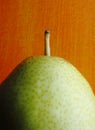 Forelle Pear against orange background Royalty Free Stock Photo