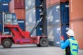 Foreman control forklift handling the container box Royalty Free Stock Photo