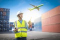 Foreman control loading containers box from cargo freight ship for import export, Foreman control industrial container cargo Royalty Free Stock Photo