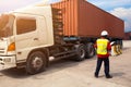 Foreman control loading Containers box to truck for Logistic Import Export background