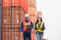 Foreman dock workers checking containers box at shipping yard, Logistics workers at shipping port with containers, Industrial Royalty Free Stock Photo