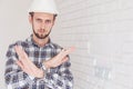 Foreman engineer, arms folded, shows a ban on action