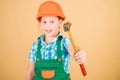 Foreman inspector. Little girl in helmet with hammer. Kid worker in hard hat. Labor day. 1 may. repair shop. hammer in Royalty Free Stock Photo