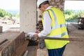 Foreman officer inspector, building Inspector, engineer or inspector at construction site checking and inspecting Royalty Free Stock Photo