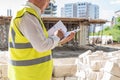 Foreman officer inspector, building Inspector, engineer or inspector at construction site checking and inspecting Royalty Free Stock Photo