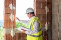 Foreman officer inspector, building Inspector, engineer or inspector at construction site checking and inspecting Royalty Free Stock Photo