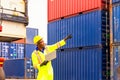 Foreman or Operator Ordering of moving containers via laptop computer. Foreman looking forword on Forklifts in the Industrial