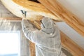 Foreman in overalls working with rockwool insulation material