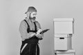 Foreman planning. unpacking moving boxes. new house at moving day. bearded man builder in boilersuit hold boxes. moving Royalty Free Stock Photo