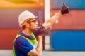 Foreman shipping staff worker working radio control loading cargo port logistic for import export goods at container warehouse