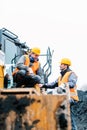 Foreman showing worker in open-cast mining pit direction Royalty Free Stock Photo