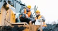 Foreman showing worker in open-cast mining pit direction