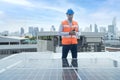 Foreman is using a radio in the area of the solar panel. Foreman and Worker maintaining solar energy panel Royalty Free Stock Photo