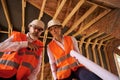 Contractor and building inspector posing for camera during home inspection Royalty Free Stock Photo