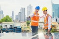 Foreman and Worker maintaining solar energy panel. Technicians checking part and equipment for solar energy station