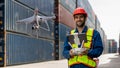 Foreman or worker use remote controller piloting drone at containers port for checking container. Foreman use remote control Drone Royalty Free Stock Photo