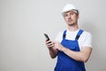 Foreman worker using smartphone on white background Royalty Free Stock Photo