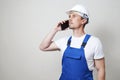 Foreman worker using smartphone on white background Royalty Free Stock Photo