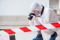 The forensic expert at crime scene doing investigation Royalty Free Stock Photo