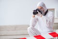 The forensic expert at crime scene doing investigation Royalty Free Stock Photo