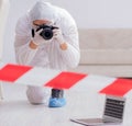 Forensic expert at crime scene doing investigation Royalty Free Stock Photo