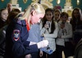 Forensic expert police shows students the techniques of collecting traces of the crime scene.