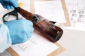 Forensic fingerprint analysis, criminalist collects latent fingerprints using fingerprint powder