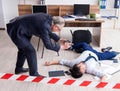 Forensic investigator and dead employee in the office Royalty Free Stock Photo